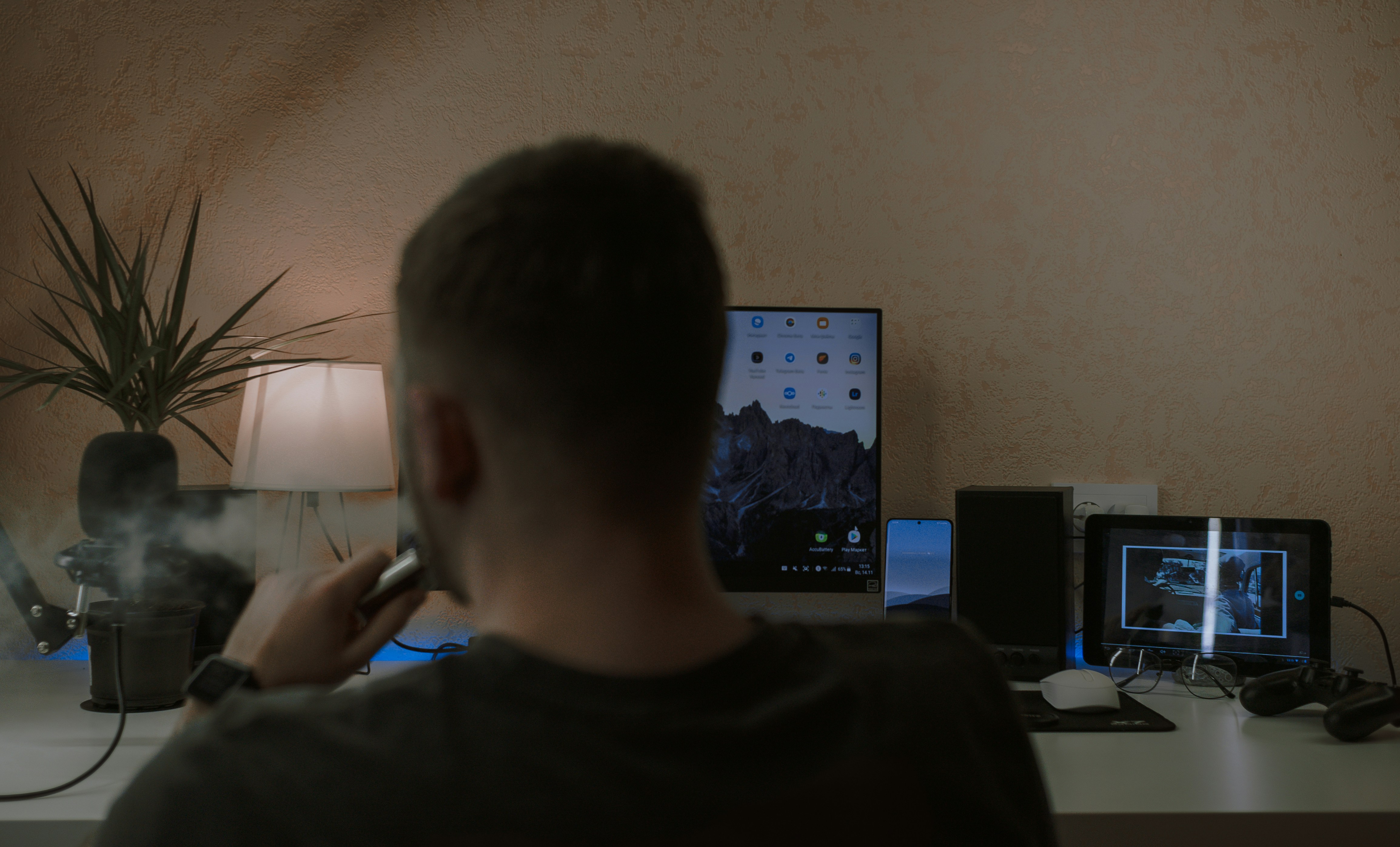 Evening celebration with multiple screens showing successful deployments
